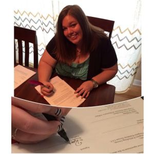 Another never-before-seen photo, signing my contract!